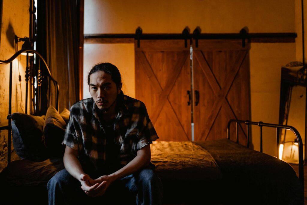 man struggling with gambling addiction and suicide risk alone