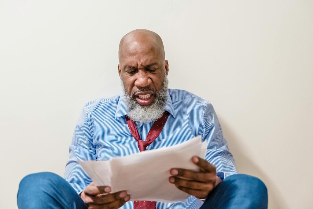 man overwhelmed by gambling debt looking for help