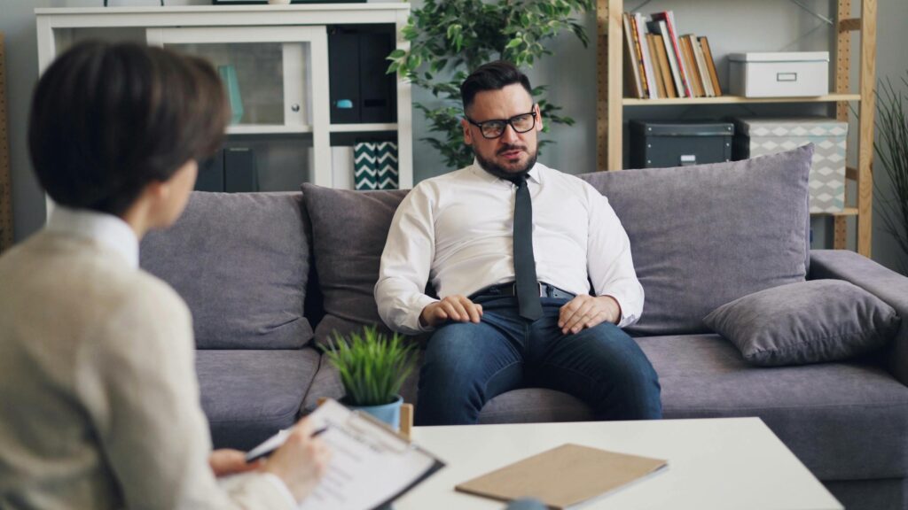 patient discussing inpatient vs outpatient gambling addiction treatment with therapist